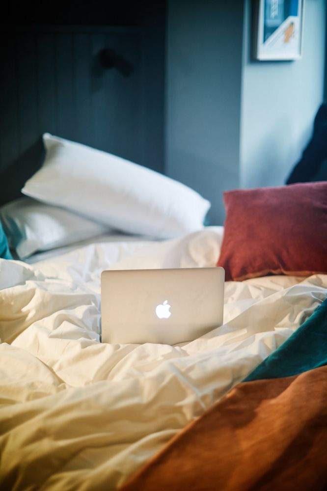 Laptop on hotel double bed